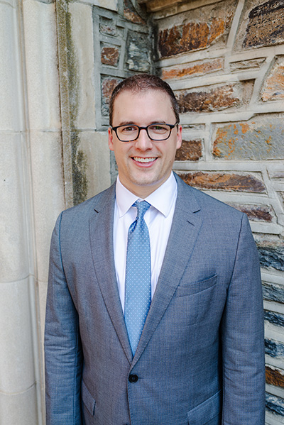 Ryan Antiel standing at corner of Duke stone building