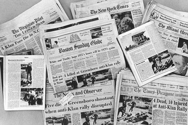 Newspapers with headlines of 1979 Greensboro Massacre